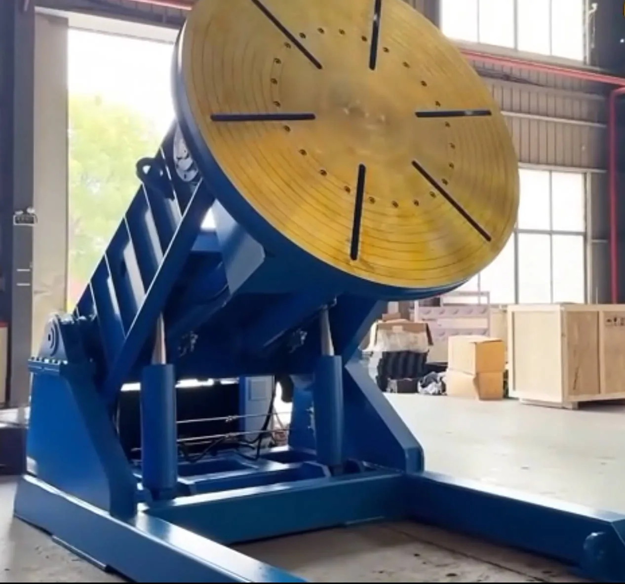 Hydraulic tilting welding positioner with worktable tilted in the workshop